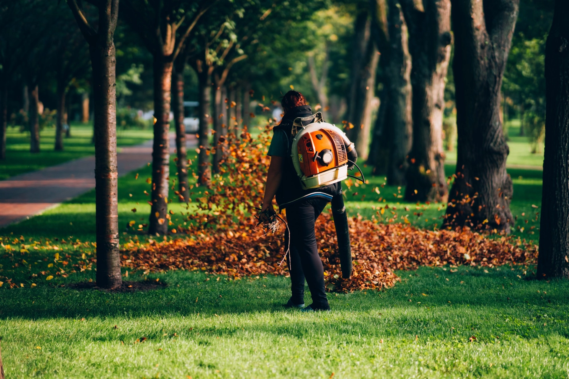 A-woman-operating-a-heavy-duty-leaf-blower